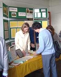 Staff and public at a display stand