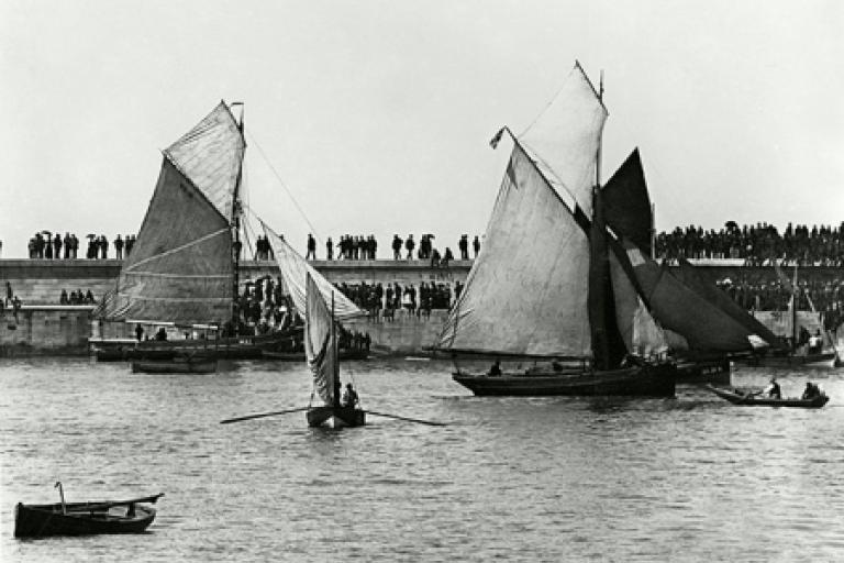 Tall ships by the shore